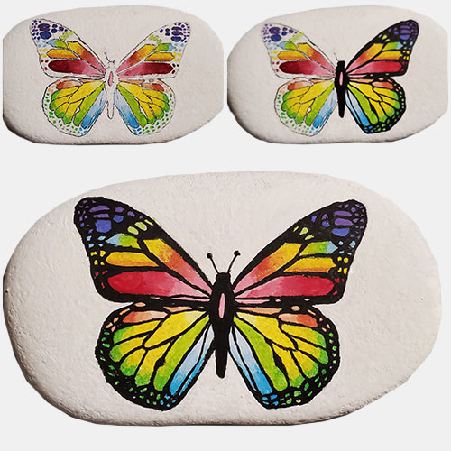 hand painted rock of a butterfly