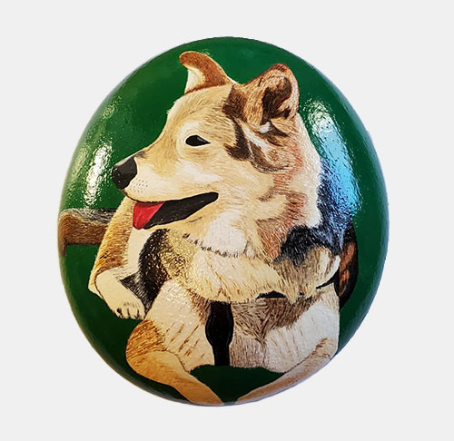 hand painted rock of a dog