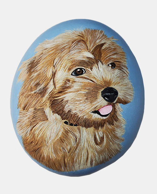 hand painted rock of a dog