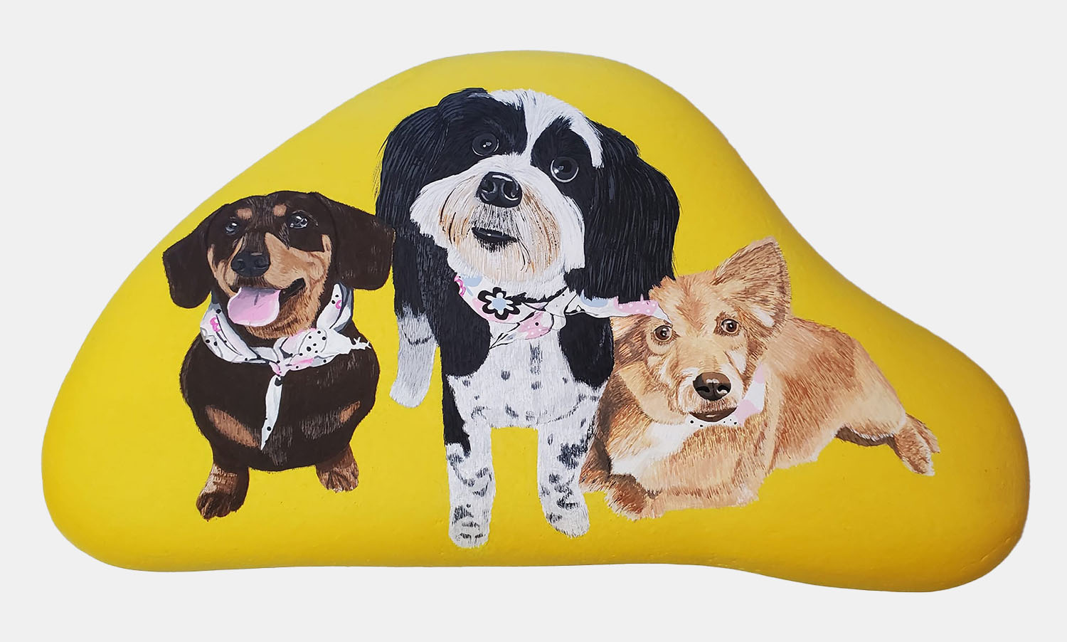 hand painted rock of three dogs