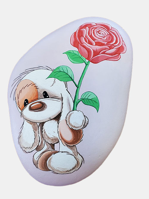 hand painted rock of a dog with a rose