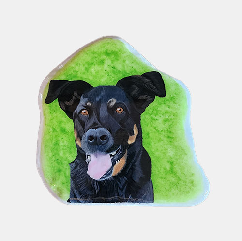 hand painted rock of a dog