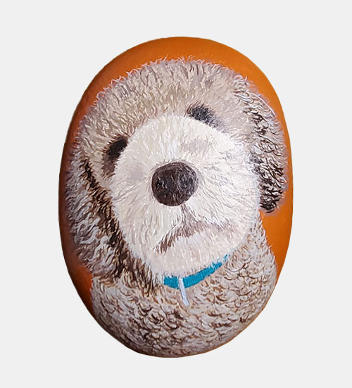 hand painted rock of a dog