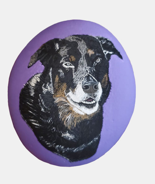 hand painted rock of a dog